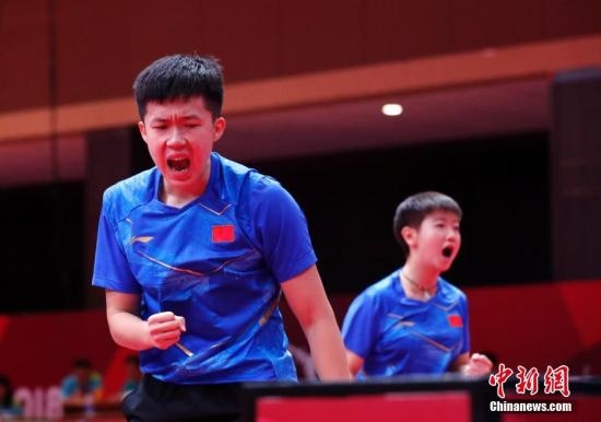 資料圖：雅加達亞運會，王楚欽/孫穎莎奪得混雙冠軍。 <a target='_blank' href='/'>中新社</a>記者 劉關(guān)關(guān) 攝